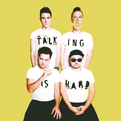 Walk The Moon band members in white shirts with fragmented text.