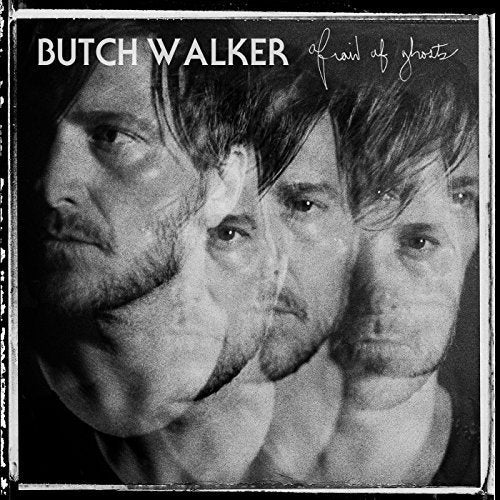 Black and white vinyl album cover with multiple exposures of a man's face.