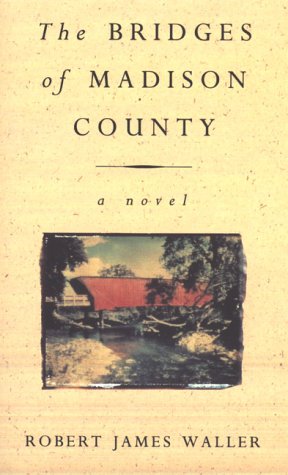 Book cover for The Bridges of Madison County featuring a red covered bridge.