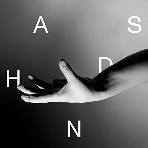 Black and white album cover featuring a hand and large letters.