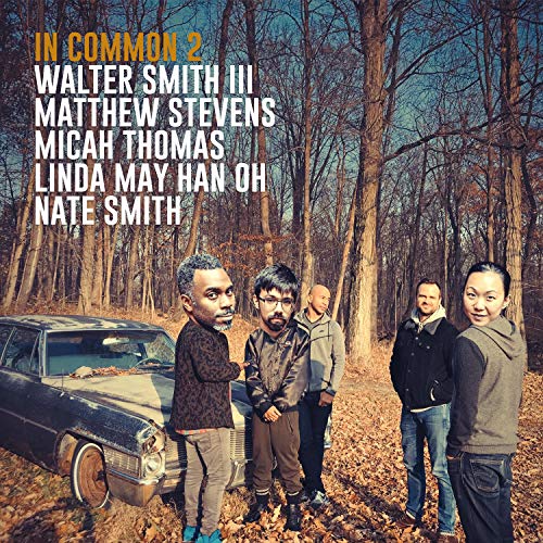 CD cover for "In Common 2" featuring a group portrait and car.