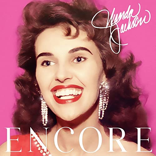 Wanda Jackson's smiling face on pink background with text reading Encore and her name.