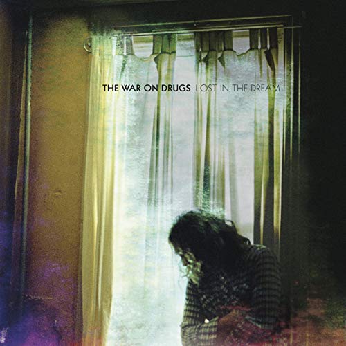 CD cover: window view with a person’s head and shoulders visible.