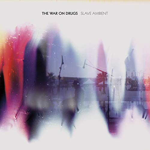 Album cover for “Slave Ambient” by The War on Drugs, blurred cityscape.
