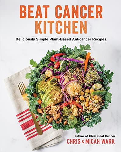 Book cover for Beat Cancer Kitchen featuring a bowl of salad and a napkin.