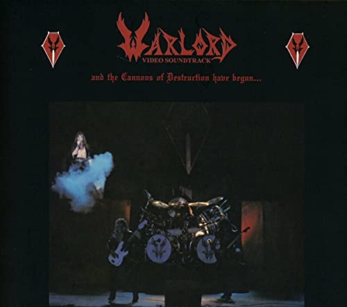 Warlord album cover showing a band performing on stage against a black background.