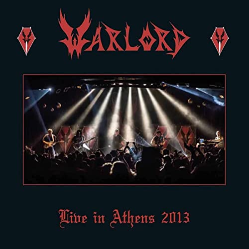 Warlord album cover: band performing on stage with bright lights.