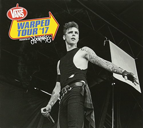 Black and white photo of a tattooed singer performing at Warped Tour 17.
