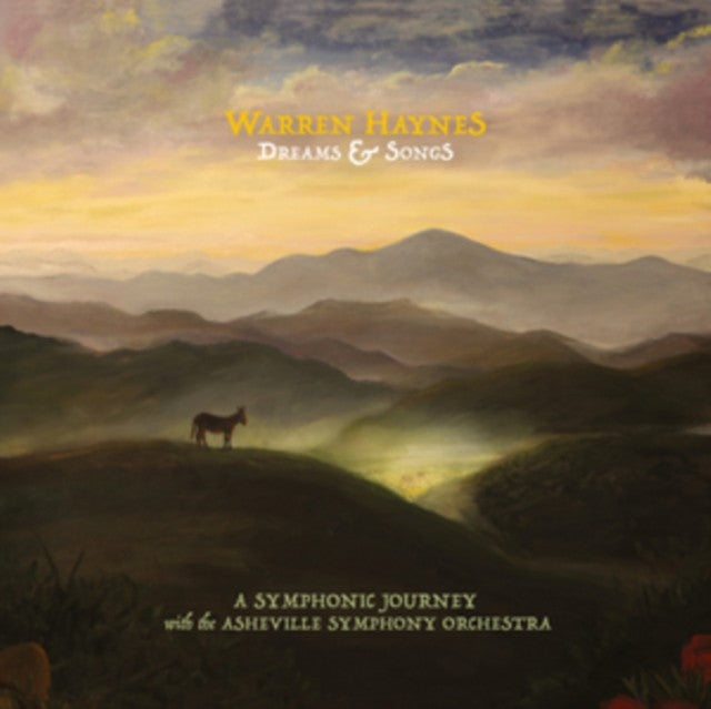Album cover for Warren Haynes’ “Dreams & Songs” featuring a horse and mountains.