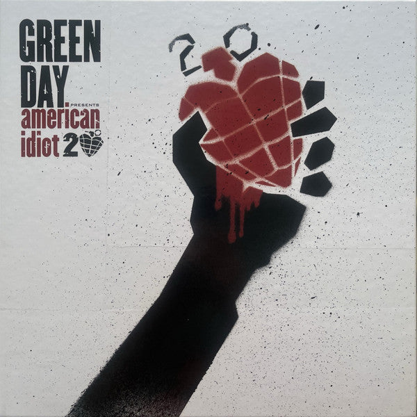 Vinyl record cover: a black hand holding a broken, dripping red heart.