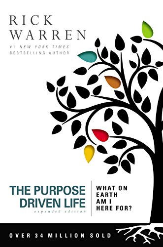 Book cover with black tree silhouette, colorful leaves, and red title text.
