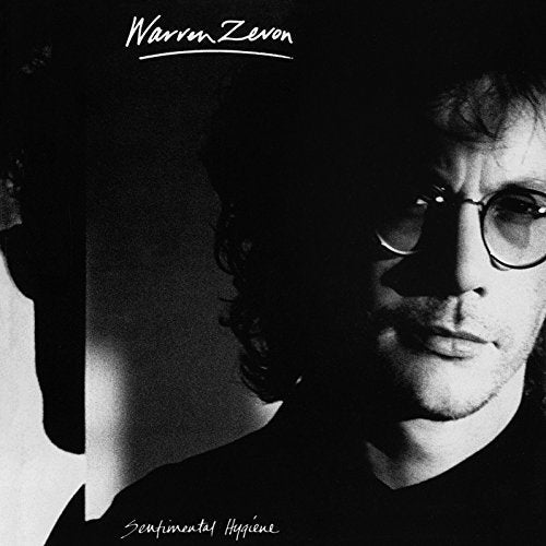 Black and white album cover featuring a portrait of Warren Zevon.