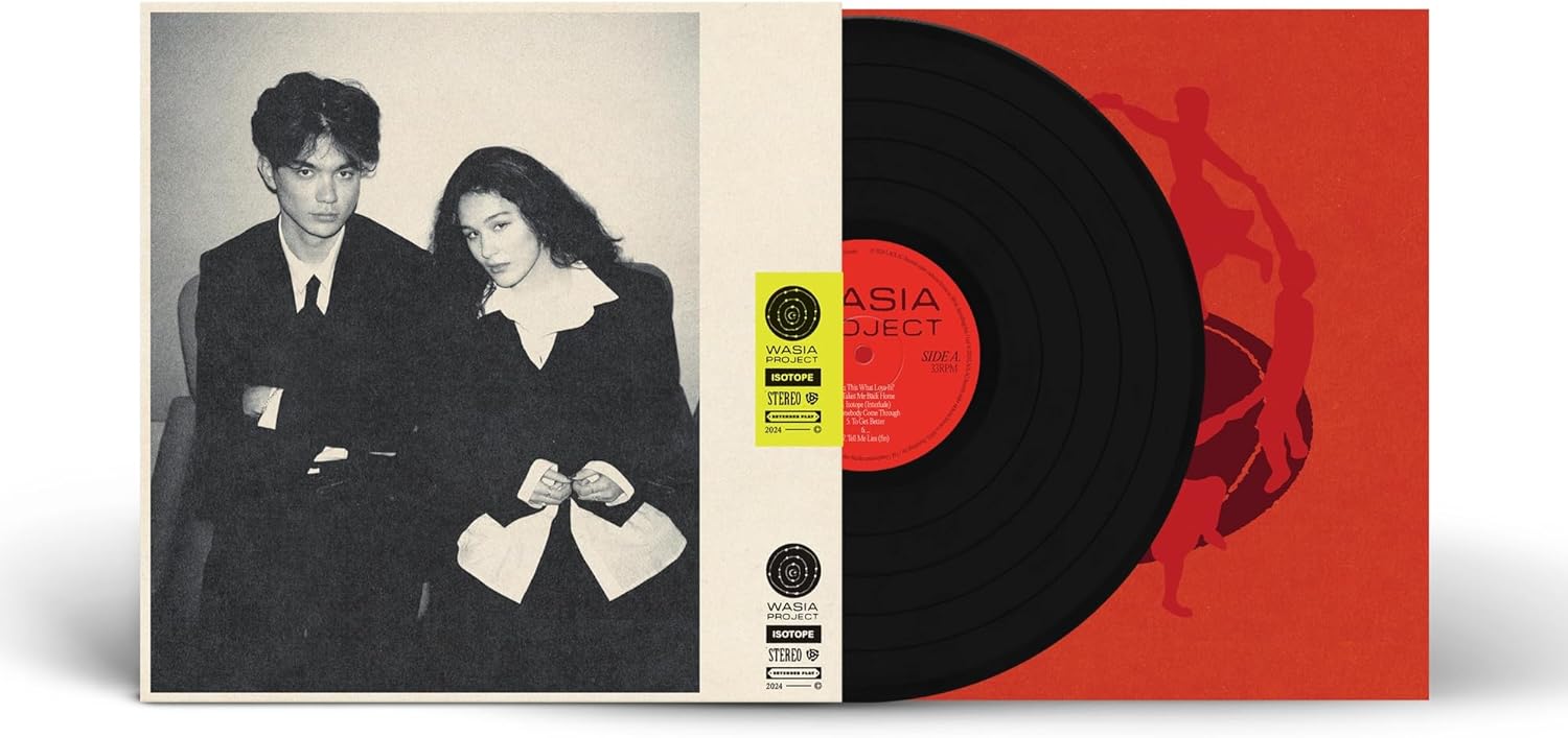 Wasia Project Isotope vinyl record with a black disc and red illustrated sleeve.