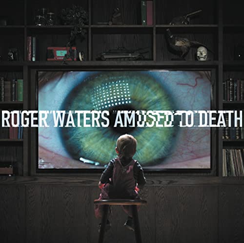 A child sits on a stool watching a giant eye on a television screen.