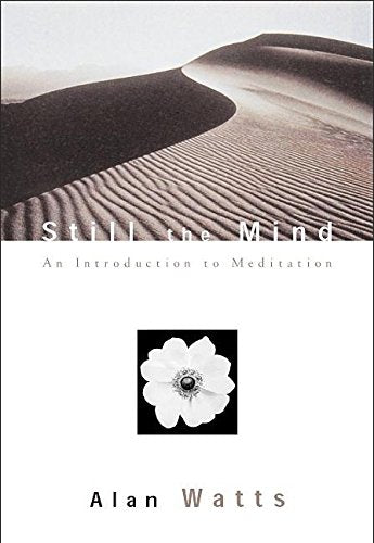 Book cover featuring a sand dune, a white flower, and text by Alan Watts.