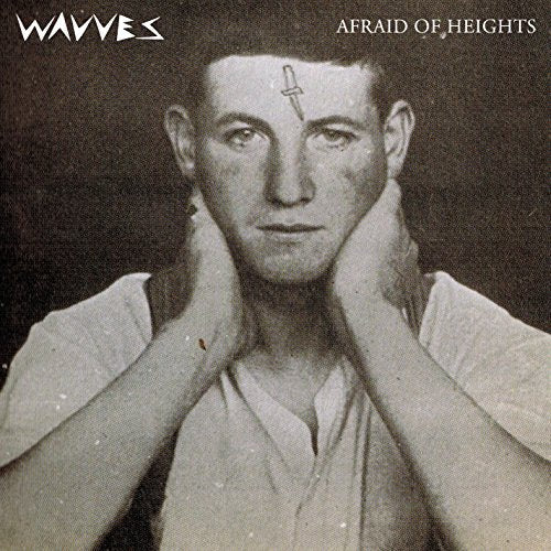 Black and white album cover featuring a young man with a knife.