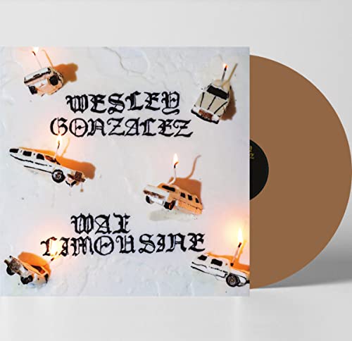 Gold vinyl record with toy limousines and lit candles on cover.