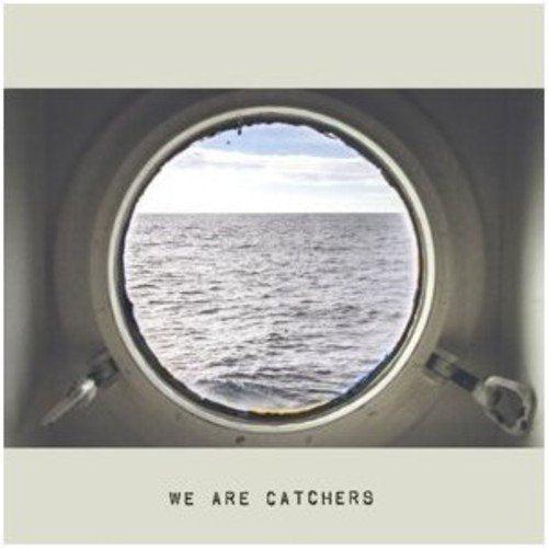 CD cover with a view of the ocean through a circular window.