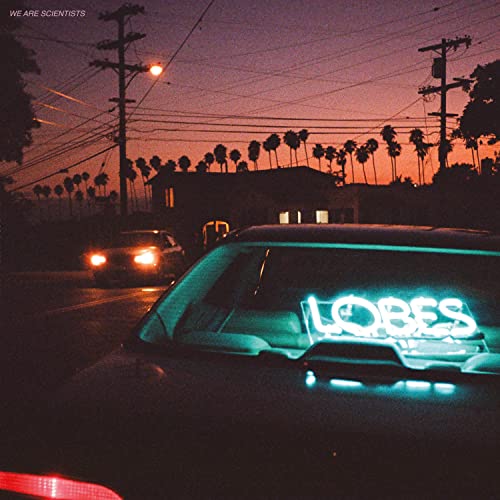 Album cover for "Lobes" by We Are Scientists, with neon text and a car.