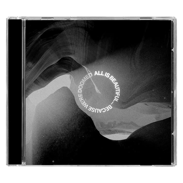 CD case with black and white canyon imagery and circular text in the center.