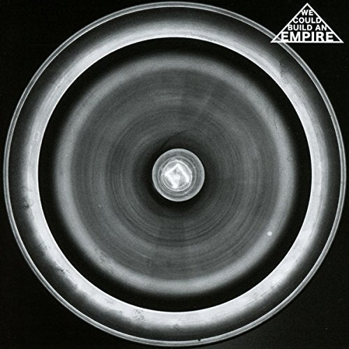 Black and white CD cover with a spiral design and text at top.