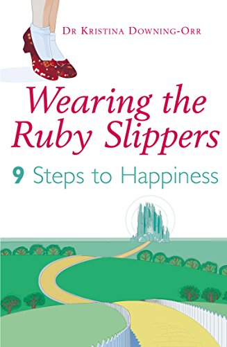 Book cover with red ruby slippers, yellow brick road, and emerald city.