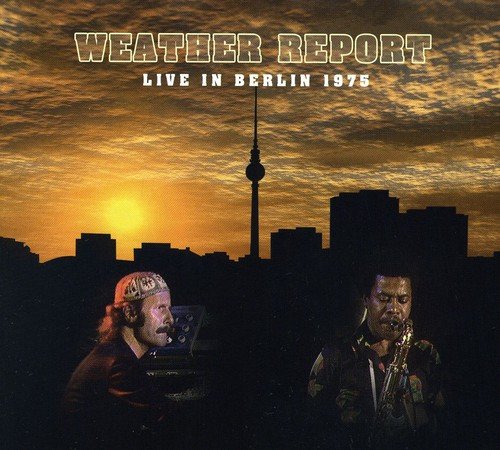 "Album cover featuring two musicians against a Berlin city skyline at sunset."