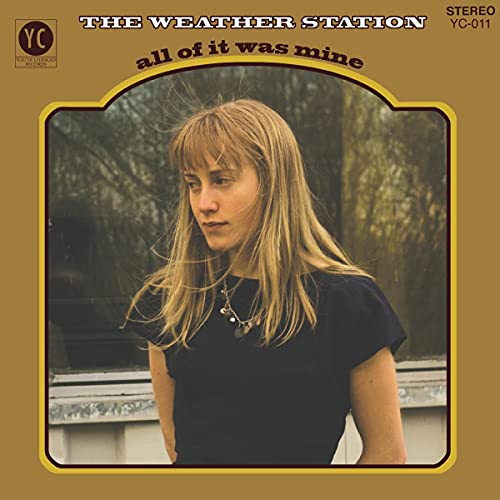 Album cover featuring a woman with blonde hair against a blurred outdoor background.