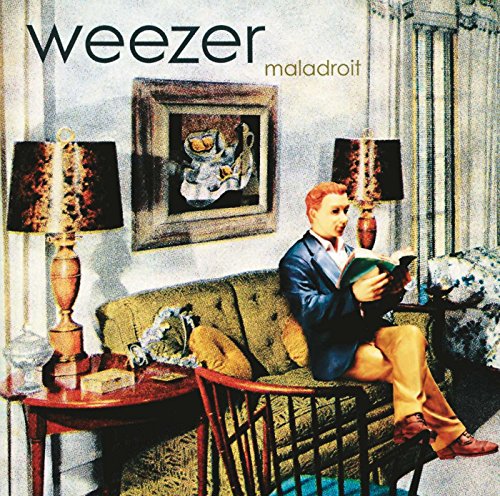 Album cover for Weezer’s “Maladroit” featuring a man reading in a room.