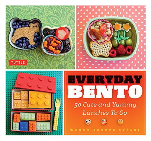 Bento box lunches with colorful food arrangements and a book cover.