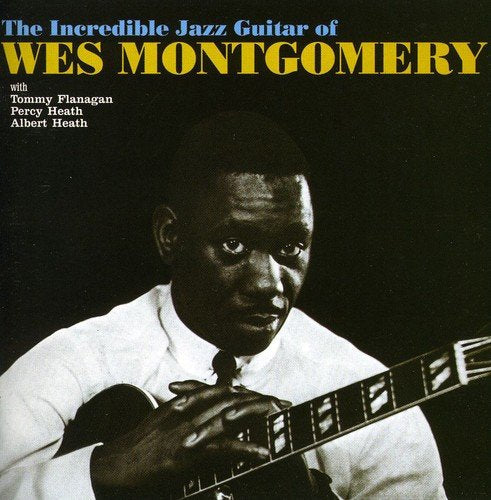 Album cover featuring Wes Montgomery playing guitar, black background, yellow and blue text.