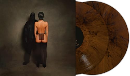 Album cover showing a masked figure and a woman next to brown marble vinyl.
