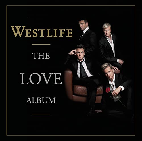 Westlife album cover featuring four men in suits, with gold text.