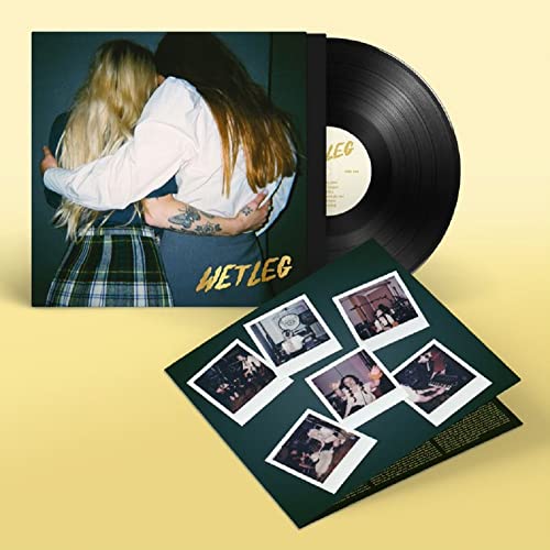 Wet Leg vinyl record with album cover, inner sleeve, and polaroid photo collage.