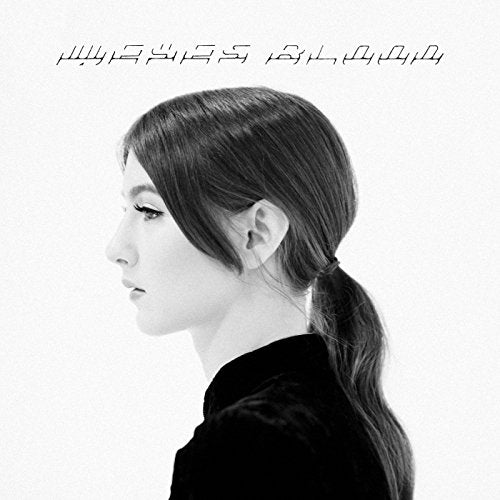 Black and white portrait of a woman in profile, album cover.