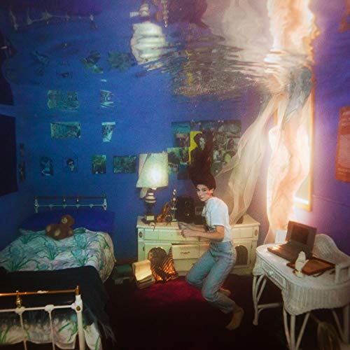 Blue bedroom scene with a woman and underwater imagery above.