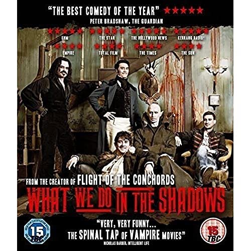What We Do in the Shadows" Blu-ray cover with four vampire characters.