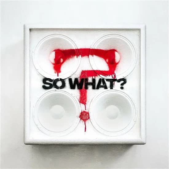 White vinyl record cover with red spray paint and text “SO WHAT?”.