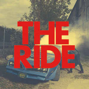 Album cover for “The Ride” featuring a damaged blue car and red text.