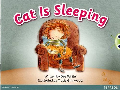 Child with orange cat sleeping in a brown armchair.