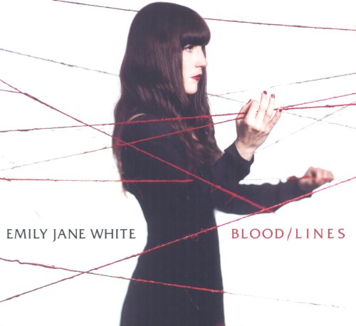 Woman with dark hair surrounded by red lines, album cover.