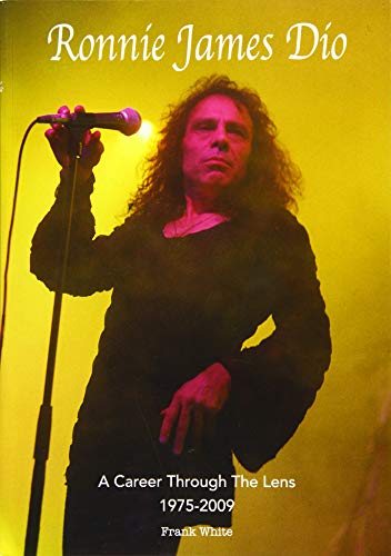 Ronnie James Dio performing on stage under yellow lights, holding a microphone.