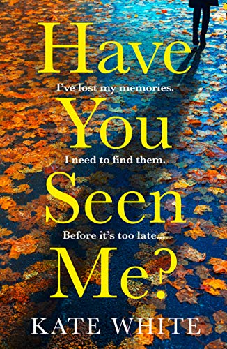 Book cover with large yellow text on a wet, leaf-strewn pavement.