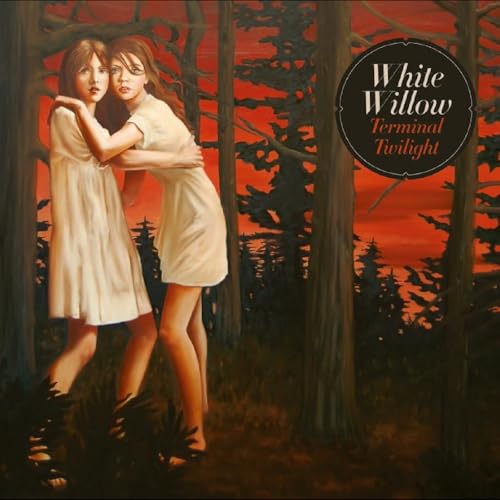Two young women embrace in a dark forest with a red sky.