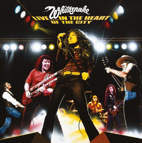 "Whitesnake album cover featuring the band performing on stage under bright lights."