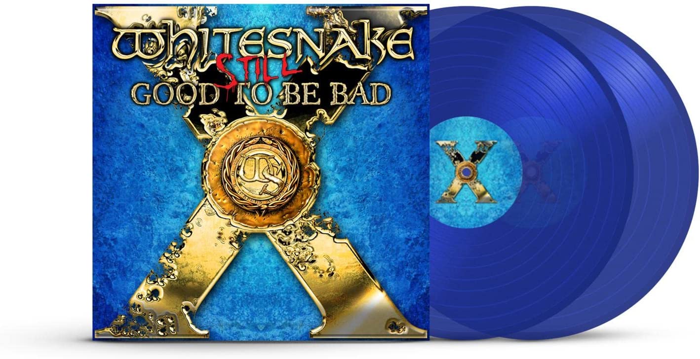 Whitesnake album cover and two blue vinyl records stacked beside it.