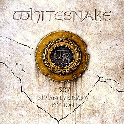 "Album cover with 'Whitesnake' title, gold emblem, and '30th Anniversary Edition' on cracked stone."