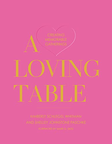 Pink book cover with gold text reading "A Loving Table" and a heart.