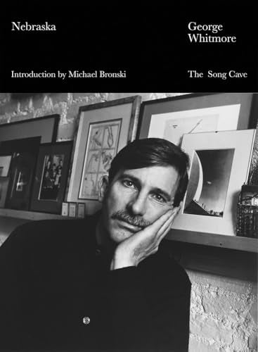 Black and white book cover featuring a man with a mustache.
