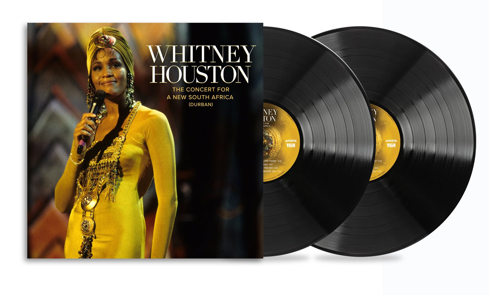 Whitney Houston concert album cover with two vinyl records beside it.
